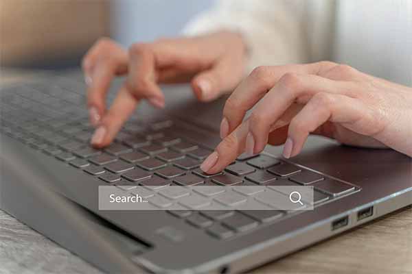 get clicks with SEO services, seo search bar in front of a computer